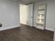 This bedroom features sleek wood floors, crisp white walls, and a convenient built-in shelving unit at 2912 E North St, Tampa, FL 33610