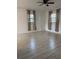 Bedroom with wood-look floors, and natural light at 2912 E North St, Tampa, FL 33610