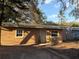 Cozy home featuring a metal roof, well-maintained front yard and inviting entrance at 2912 E North St, Tampa, FL 33610