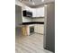 Modern kitchen features sleek countertops, stainless steel appliances, and stylish cabinets at 2912 E North St, Tampa, FL 33610