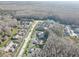 An aerial view of the neighborhood and the surrounding wooded area at 3200 Charter Club Dr # A1, Tarpon Springs, FL 34688