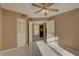 Neutral-toned bedroom showcasing closet and connecting doorway to the house at 3200 Charter Club Dr # A1, Tarpon Springs, FL 34688