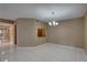 Open dining area with tiled floors and a view of the kitchen at 3200 Charter Club Dr # A1, Tarpon Springs, FL 34688