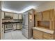 Traditional kitchen featuring stainless steel appliances, light wood trim, and tile backsplash at 3200 Charter Club Dr # A1, Tarpon Springs, FL 34688