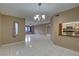 Bright and airy living space with tile flooring, and an open view to the kitchen at 3200 Charter Club Dr # A1, Tarpon Springs, FL 34688