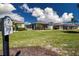 A landscaped backyard with golf course views at 328 Siena Vista Pl, Sun City Center, FL 33573