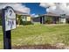 A lush backyard of home with a golf course view and landscaped details at 328 Siena Vista Pl, Sun City Center, FL 33573