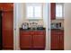 Butler's Pantry features lots of natural light and cabinet space at 328 Siena Vista Pl, Sun City Center, FL 33573