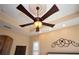 Close up of ceiling fan with decorative medallion and adjacent wall decor at 328 Siena Vista Pl, Sun City Center, FL 33573