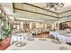 Formal dining room with round tables, covered in white tablecloths, surrounded by comfortable chairs at 328 Siena Vista Pl, Sun City Center, FL 33573