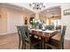 Dining room with wood table, seating for six, and an abundance of natural light at 328 Siena Vista Pl, Sun City Center, FL 33573