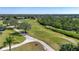 Overhead view of golf course featuring mature trees and lush green landscape in community at 328 Siena Vista Pl, Sun City Center, FL 33573