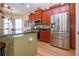 Kitchen with stainless steel appliances and a view of the center island with bar stool seating at 328 Siena Vista Pl, Sun City Center, FL 33573