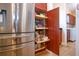 Kitchen features stainless steel appliances and a pull out storage shelving at 328 Siena Vista Pl, Sun City Center, FL 33573