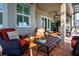 Inviting screened lanai with comfortable seating, views, and stylish decor at 328 Siena Vista Pl, Sun City Center, FL 33573
