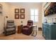 Comfortable living room featuring hardwood floors, natural lighting, and stylish decor at 328 Siena Vista Pl, Sun City Center, FL 33573
