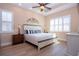 The main bedroom features a king bed, hardwood floors, and lots of natural light at 328 Siena Vista Pl, Sun City Center, FL 33573