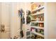 Walk-in pantry features wire shelving and ample space for storage at 328 Siena Vista Pl, Sun City Center, FL 33573