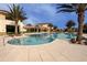 Beautiful outdoor pool with palm trees, inviting for a refreshing swim at 328 Siena Vista Pl, Sun City Center, FL 33573
