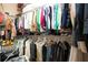 Organized walk-in closet with hanging clothes, shelving, and storage at 328 Siena Vista Pl, Sun City Center, FL 33573