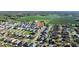 Wide aerial perspective of the home within a residential neighborhood, near green fields at 3301 San Moise Pl, Plant City, FL 33567