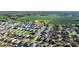 Aerial view of a suburban community showcasing houses with well-manicured lawns and green spaces at 3301 San Moise Pl, Plant City, FL 33567