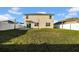 Large backyard with a well-maintained lawn, white fence, and a view of the home's rear exterior at 3301 San Moise Pl, Plant City, FL 33567