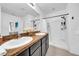Bright bathroom featuring dual sinks and a walk-in shower at 3301 San Moise Pl, Plant City, FL 33567