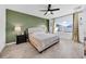 Serene bedroom featuring a large window, neutral color palette, and ample natural light, creating a peaceful retreat at 3301 San Moise Pl, Plant City, FL 33567