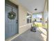 Inviting front porch with rocking chairs and a view of the neighborhood at 3301 San Moise Pl, Plant City, FL 33567