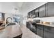 Well-lit kitchen with stainless steel appliances and an adjacent dining area at 3301 San Moise Pl, Plant City, FL 33567