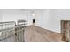 Upstairs hallway with neutral carpet and walls, with access to bedrooms and bathrooms at 3301 San Moise Pl, Plant City, FL 33567