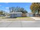 Backyard view with a detached two-car garage and car port at 3512 E 23Rd Ave, Tampa, FL 33605