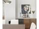 Bright dining area features modern art, a wine refrigerator, and an adjacent pantry at 3618 W Royal Palm Cir, Tampa, FL 33629