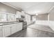 Well-lit kitchen featuring granite countertops, stainless steel appliances, and updated cabinetry at 3814 N 48Th St, Tampa, FL 33605