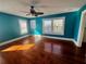 Sunny bedroom featuring hardwood floors, and multiple windows at 4742 9Th S Ave, St Petersburg, FL 33711