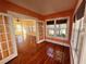 Inviting dining room featuring gleaming hardwood floors and large windows that bring in lots of natural light at 4742 9Th S Ave, St Petersburg, FL 33711