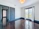 Bright bedroom with glossy hardwood floors, and double doors to the outside at 4827 7Th N Ave, St Petersburg, FL 33713