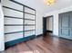 Bedroom featuring hardwood floors, built-in shelves, and blue trim at 4827 7Th N Ave, St Petersburg, FL 33713