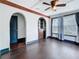 Bright bedroom featuring archway details, hardwood floors and natural light creating a warm and welcoming space at 4827 7Th N Ave, St Petersburg, FL 33713