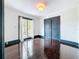 Bedroom featuring hardwood floors and sliding closet doors at 4827 7Th N Ave, St Petersburg, FL 33713