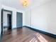 Bedroom with hardwood floors and a door leading to another room at 4827 7Th N Ave, St Petersburg, FL 33713