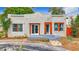 Charming single-story home with unique architectural details and inviting orange-trimmed windows at 4827 7Th N Ave, St Petersburg, FL 33713