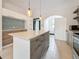 Bright kitchen features stainless steel appliances, island, and stylish two-tone cabinetry at 4827 7Th N Ave, St Petersburg, FL 33713