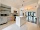 Modern kitchen with stainless steel appliances, a central island and an open layout at 4827 7Th N Ave, St Petersburg, FL 33713