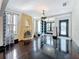 Living room boasts a decorative fireplace, hardwood floors, and natural light from multiple windows at 4827 7Th N Ave, St Petersburg, FL 33713