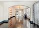 Bright living area features hardwood floors, arched doorways and access to the kitchen at 4827 7Th N Ave, St Petersburg, FL 33713