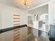 Living area displays hardwood floors and arched doorway to the modern kitchen at 4827 7Th N Ave, St Petersburg, FL 33713