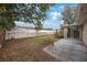 Spacious backyard featuring a patio, grass, and fencing for privacy and outdoor enjoyment at 5317 Tammy Ln, Holiday, FL 34690