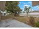 Private backyard with a concrete patio and partial fencing, ready for your personal touch at 5317 Tammy Ln, Holiday, FL 34690